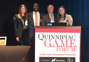 Advisor Professor Root along with two students and Dr. Charles Appeadu of the CFA Institute after he presented LSSU with 1st place in the growth division of the student portfolio competition.